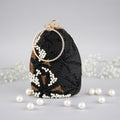 BLACK SNOWFLAKE CLUTCH BAG
